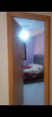 a room with a room with a bed and a light at mina residence