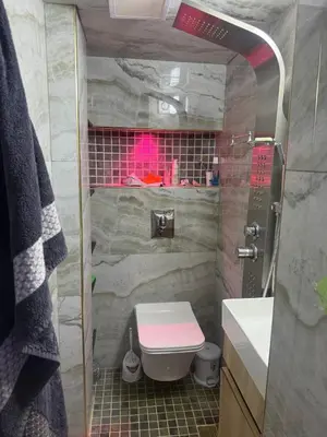 a small bathroom with a toilet and a sink at Appartement Fès standing in Fès