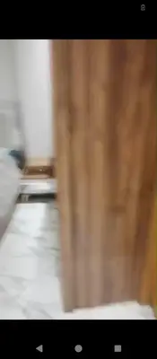 a blurry picture of a wooden wall in a room at Amir's home in Meknès