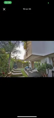 a picture of a house with a tree and stairs at Vila en fes in Fès