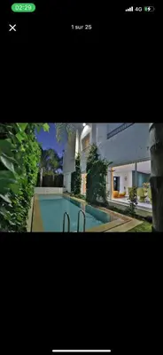 a picture of a house with a swimming pool at Vila en fes in Fès