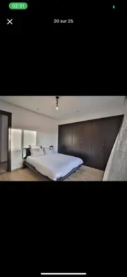 a bedroom with a large white bed in it at Vila en fes in Fès