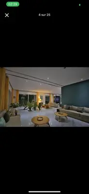a large living room with couches and tables in it at Vila en fes in Fès
