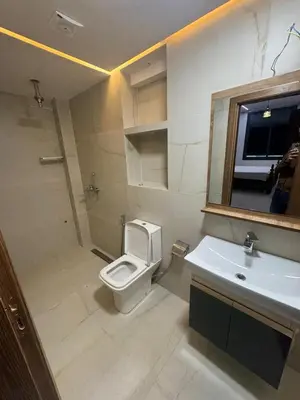 a bathroom with a toilet and a sink and a mirror at Hotel kairouan in Fès