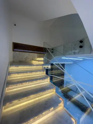 a staircase in a house with a glass wall at Hotel kairouan in Fès