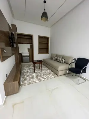 a living room with a couch and a table at Hotel kairouan in Fès