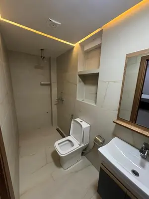 a bathroom with a toilet and a sink and a mirror at Hotel kairouan in Fès