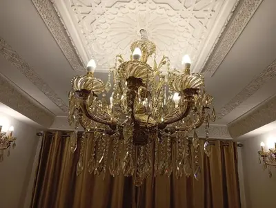 a chandelier hanging from a ceiling in a room at Dar AWRABIA in Fès