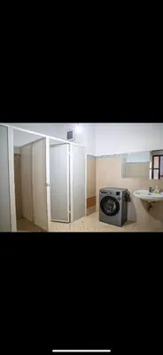 a small kitchen with a stove and a sink at Appartement très spacieux au coeur de Temara à 10 minutes du grand stade de Rabat in Oulad Akkou
