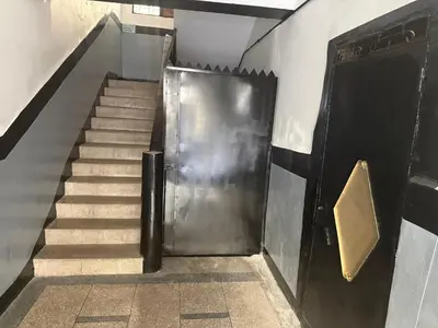 a staircase with a metal door and a set of stairs at Fes Apartment 2 in Fès