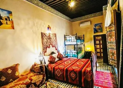 a bedroom with a bed in a room at PanoramicFES Riad in Fès