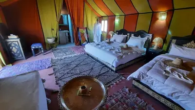 a bedroom with two beds in a room at luxury camp Oasis Opal in Merzouga
