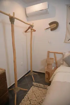 a bedroom with a bed and two floor lamps at La Perle de Setti Fadma in Ourika