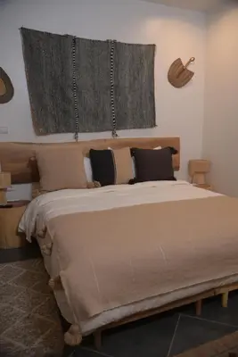a bedroom with a large bed and a window at La Perle de Setti Fadma in Ourika