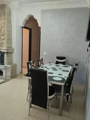 a dining room with a table and chairs at jardaine d'Ifrane in Ifrane