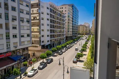 a view of a city street with cars on the road at Chic Beachfront Studio Appartment in Oulad Akkou