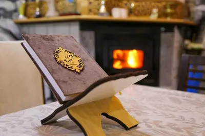 a wooden chair with a hat on top of a table at Gite Atlas Tigrigra