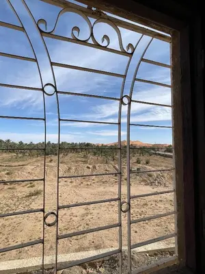 an open window with a view of the desert at Maison zahra merzouga in Merzouga