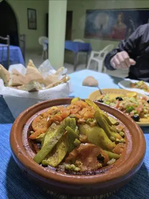 a bowl of food sitting on top of a table at Maison zahra merzouga in Merzouga