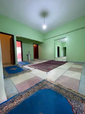 an empty room with a pool of water on the floor at Maison zahra merzouga in Merzouga