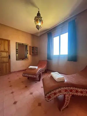 a room with two beds and a window at Private pool villa & garden Marrakech in Marrakech