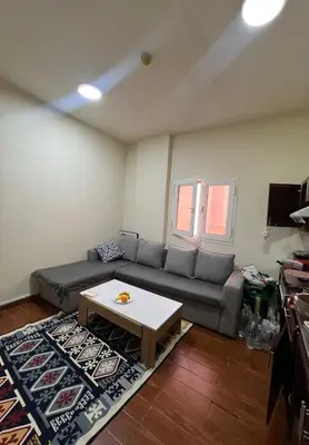 a living room with a couch and a coffee table at altijan