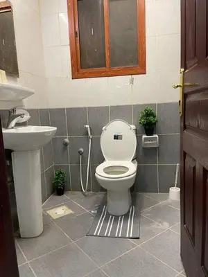 a bathroom with a toilet and a sink at altijan