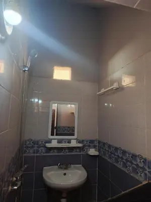 a bathroom with a sink and a mirror at taddart in Merzouga