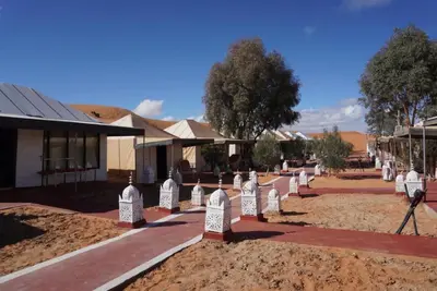 a row of gravestones in front of a building at Ousaadi luxury desert camp in Merzouga