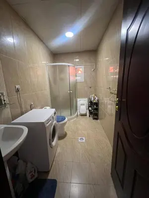 a bathroom with a shower and a toilet and a sink at altijan