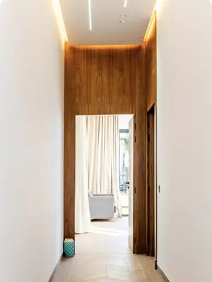 a hallway with a door leading to a living room at Villa Dar Jannat Marrakech in Aït Namous