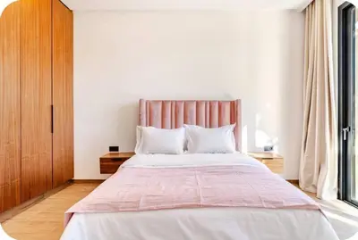 a bedroom with a large bed and a large window at Villa Dar Jannat Marrakech in Aït Namous