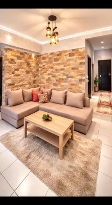a living room with a couch and a coffee table at Fes Saiss Residence in Fès
