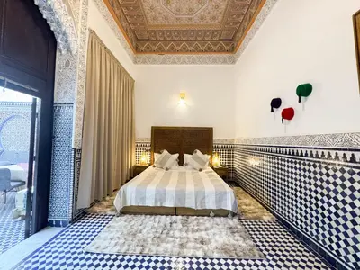 a bedroom with a bed and a ceiling at Riad Azul Fes & SPA in Fès