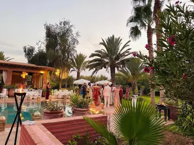 a group of people standing outside of a wedding reception at Villa Ishtar in Marrakech