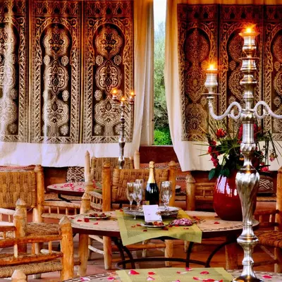 a dining room with a table and chairs at Villa Ishtar in Marrakech