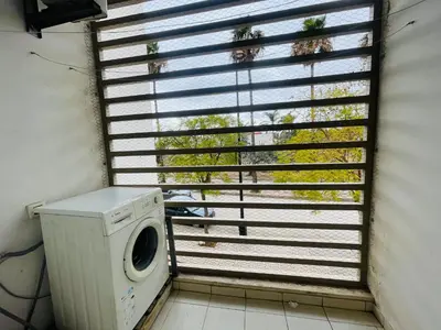a washing machine in a room with a window at Résidence chic et sécurisé - 2 chambres à Prestigia in Fès