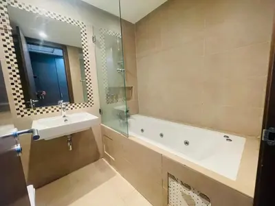 a bathroom with a sink and a tub and a shower at Résidence chic et sécurisé - 2 chambres à Prestigia in Fès