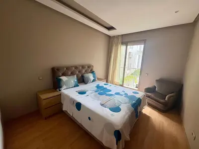 a bedroom with a large bed and a window at Résidence Prestigia Fès centre - 3 chambres in Fès