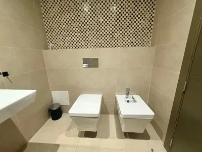 a bathroom with a toilet and a sink at Résidence Prestigia Fès centre - 3 chambres in Fès