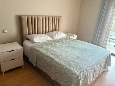 a small bedroom with a bed and a nightstand and a bed sidx sidx sidx at Résidence Prestigia Fès centre - 3 chambres in Fès