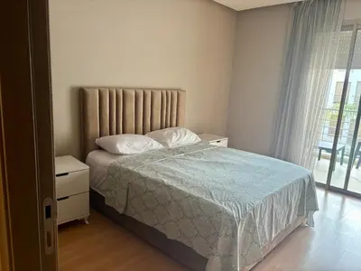 a bedroom with a bed and a window at Résidence Prestigia Fès centre - 3 chambres in Fès