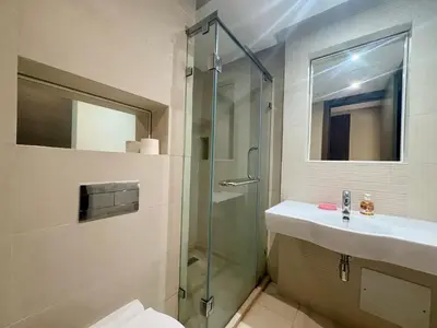 a bathroom with a shower and a sink and a toilet at Résidence Prestigia Fès centre - 3 chambres in Fès