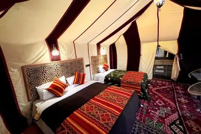 a bedroom with two beds in a room at Camping Activities Merzouga in Merzouga