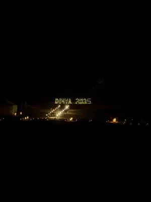 a night view of a city with lights in the dark at Morocco Desert Camp in Merzouga