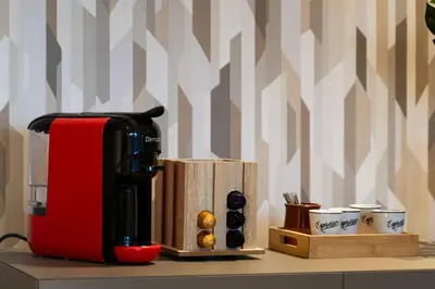 a coffee maker sitting on top of a counter at Modern Loft in City Center in Oulad Akkou