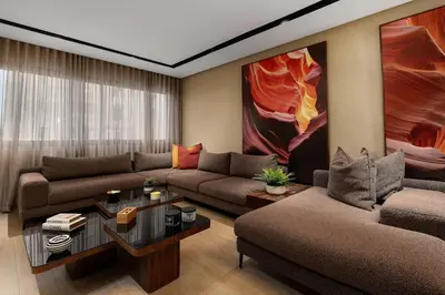 a living room with a couch and a table at Modern Loft in City Center in Oulad Akkou