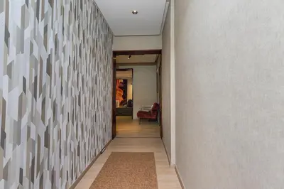 a hallway of a house with a wall at Modern Loft in City Center in Oulad Akkou