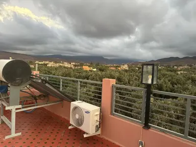 a balcony with a fan and a camera at Private Villa, Pool, Gym, Atlas View in Ourika