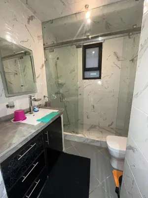 a bathroom with a shower and a sink and a toilet at Private Villa, Pool, Gym, Atlas View in Ourika